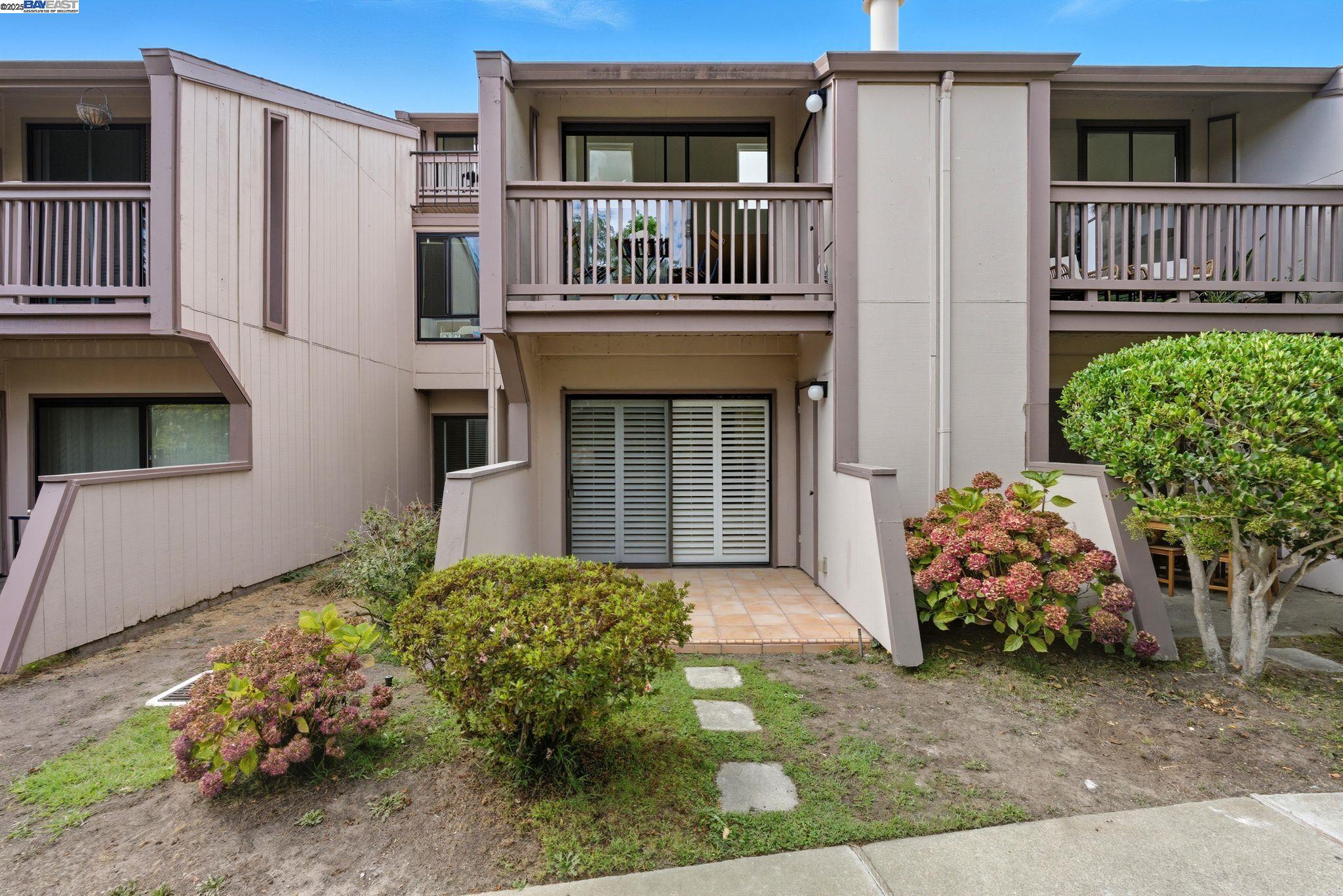 2101 Shore Line Drive, Unit 233 Alameda, CA 94501 - Photo 13 of 47 a front view of a house with garden