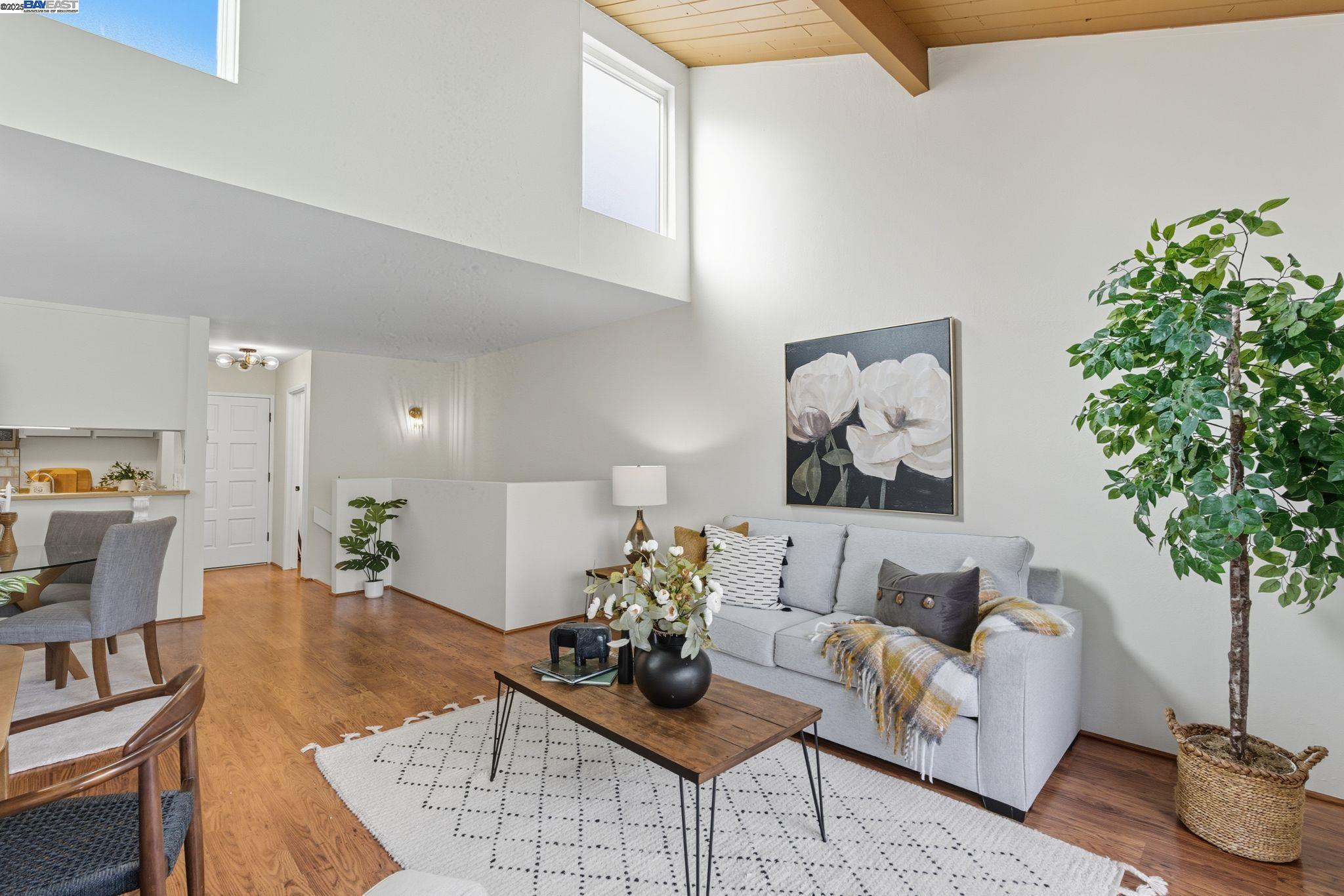 2101 Shore Line Drive, Unit 233 Alameda, CA 94501 - Photo 20 of 47 a living room with furniture potted plant and a window