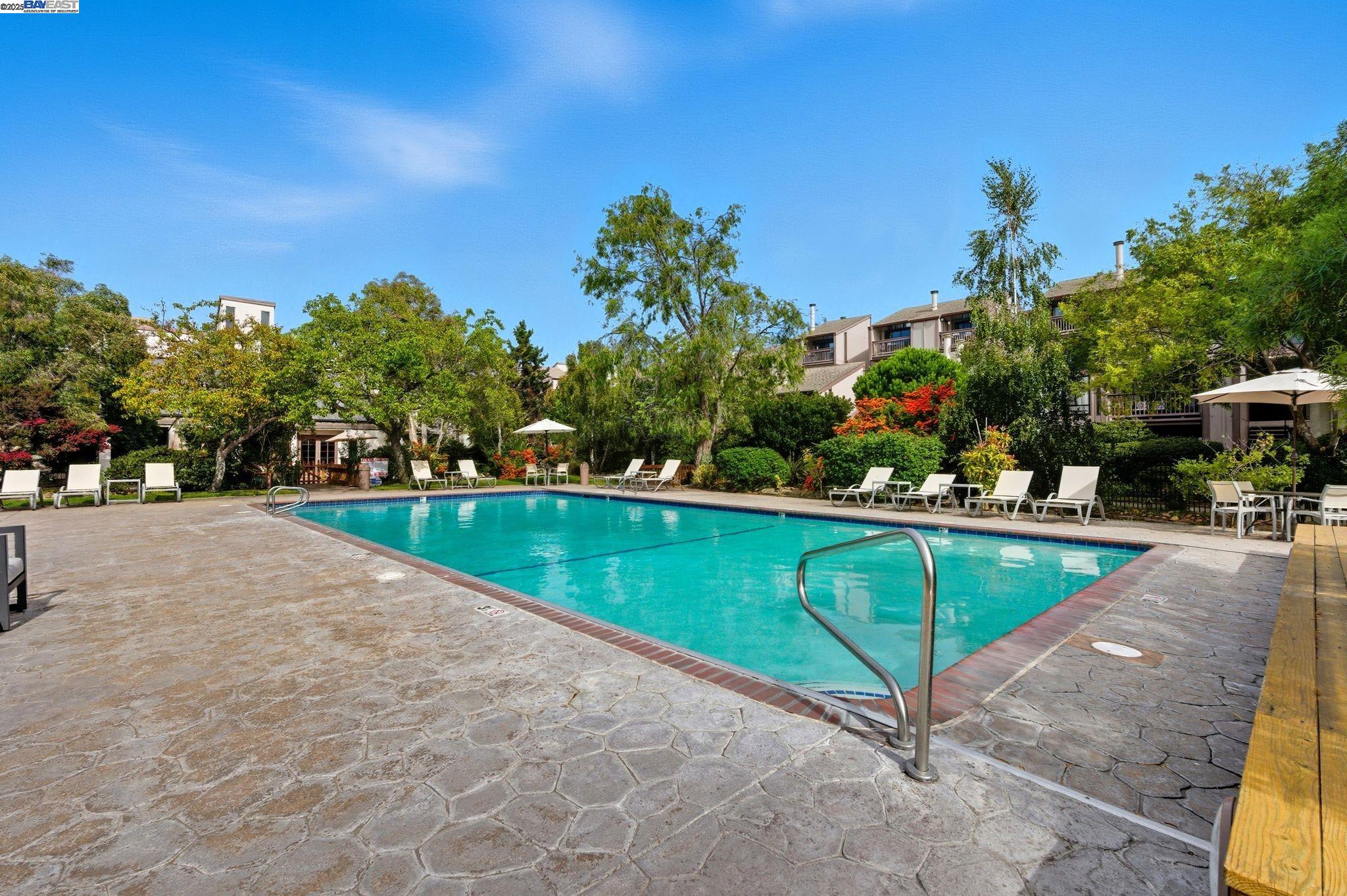 2101 Shore Line Drive, Unit 233 Alameda, CA 94501 - Photo 2 of 47 a view of swimming pool with outdoor seating and yard in back