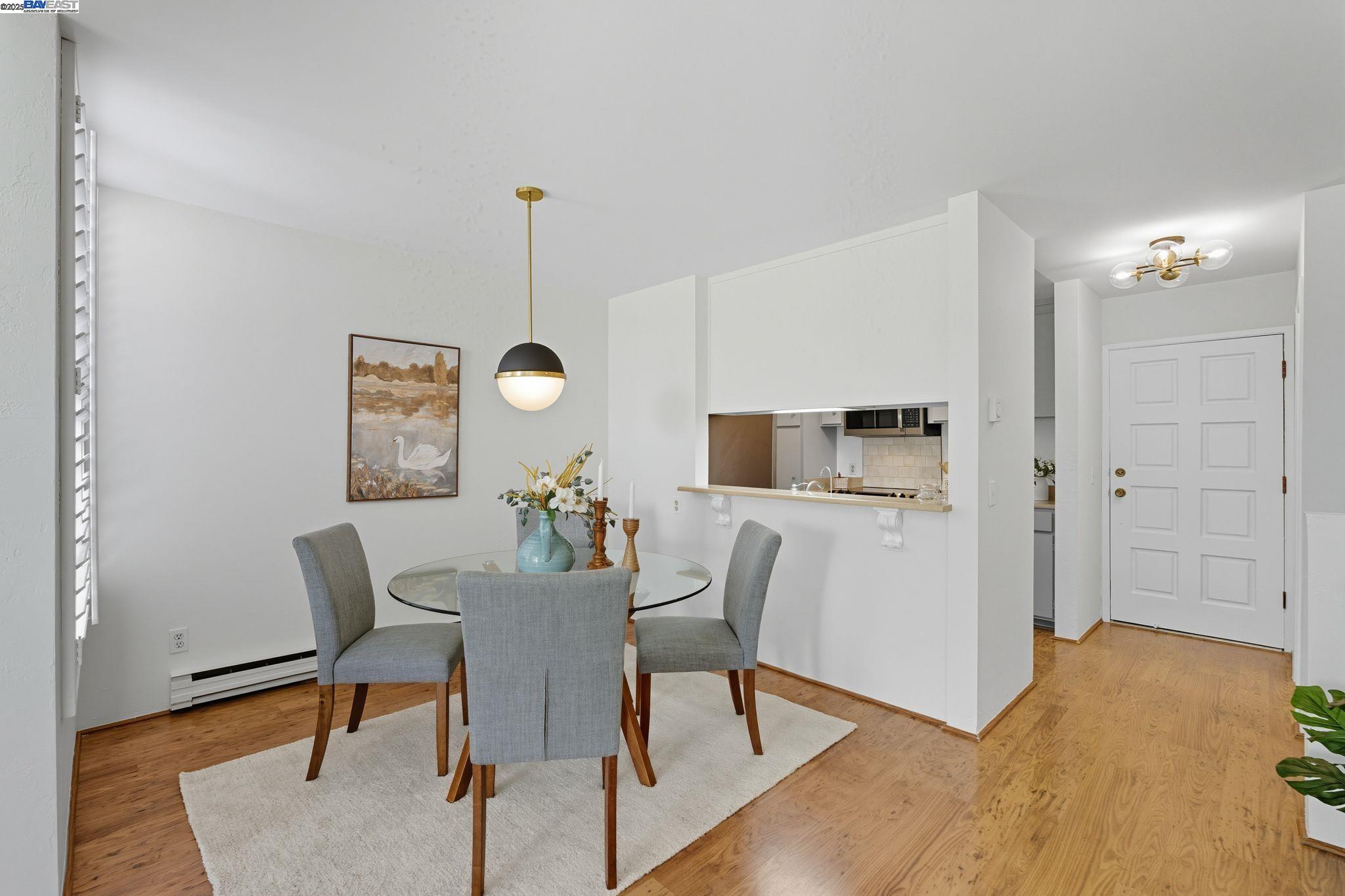 2101 Shore Line Drive, Unit 233 Alameda, CA 94501 - Photo 25 of 47 a view of a dining room with furniture and wooden floor