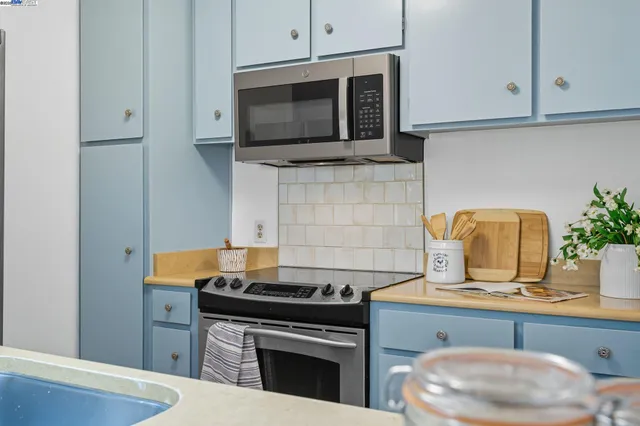 a kitchen with a stove and a microwave