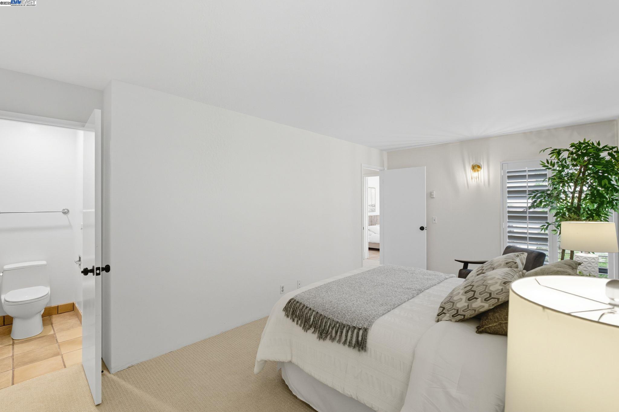 2101 Shore Line Drive, Unit 233 Alameda, CA 94501 - Photo 35 of 47 a bedroom with a bed and a table