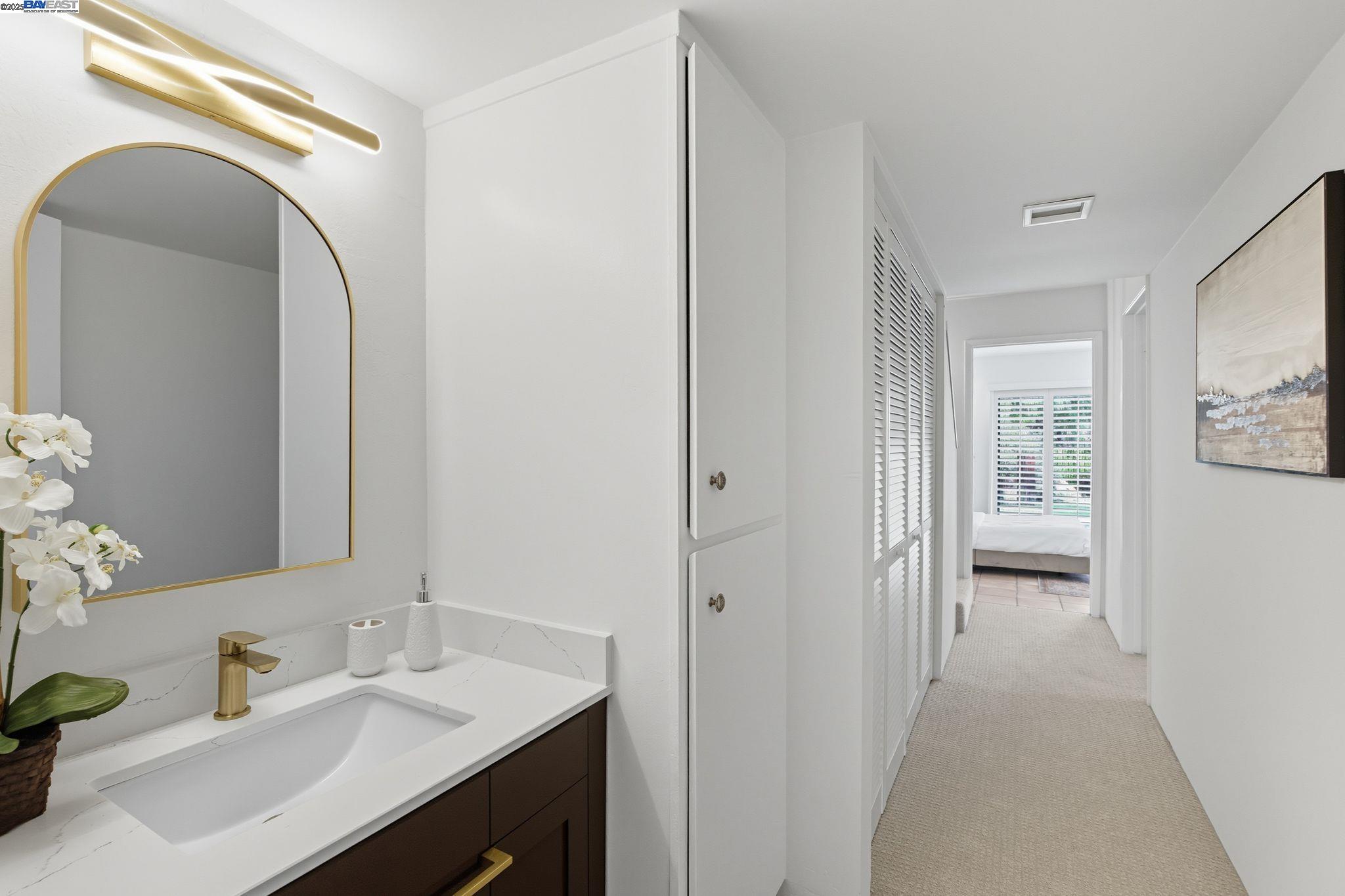 2101 Shore Line Drive, Unit 233 Alameda, CA 94501 - Photo 37 of 47 a en suite bathroom with a sink mirror and vanity