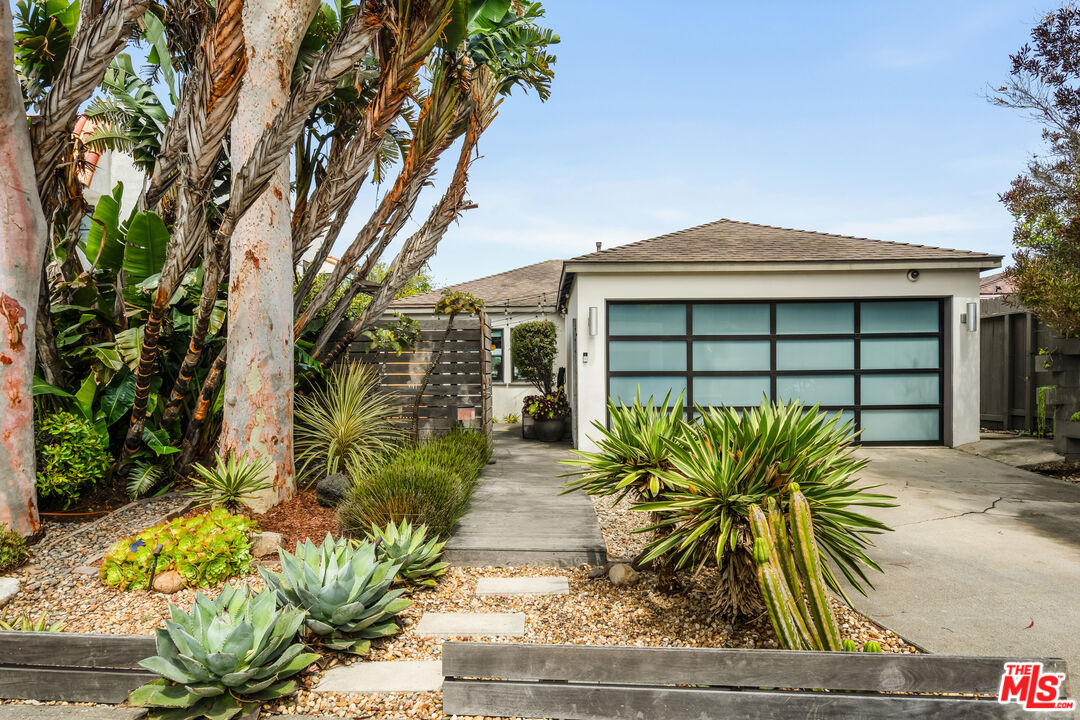 7406 Earldom Avenue Playa del Rey, CA 90293 - Photo 1 of 61 a front view of a house with a yard