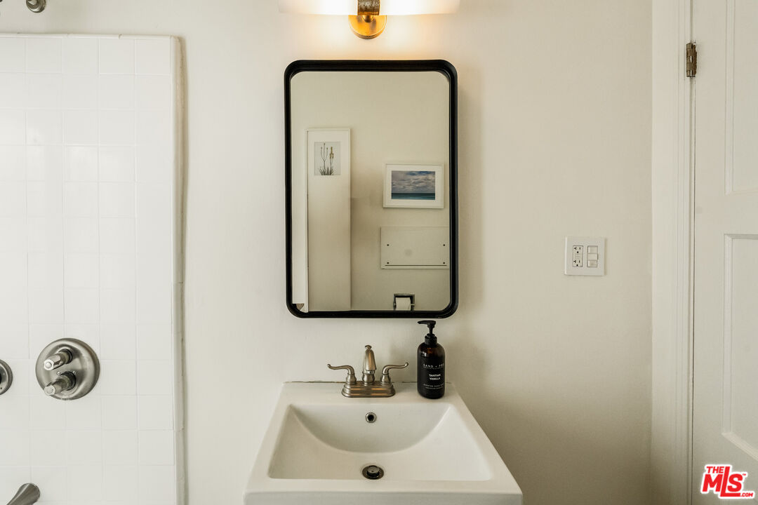 7406 Earldom Avenue Playa del Rey, CA 90293 - Photo 22 of 61 a bathroom with a sink and a mirror