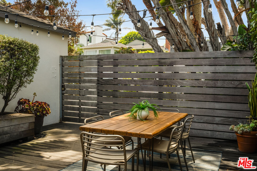 7406 Earldom Avenue Playa del Rey, CA 90293 - Photo 7 of 61 a view of a chairs and table in a patio