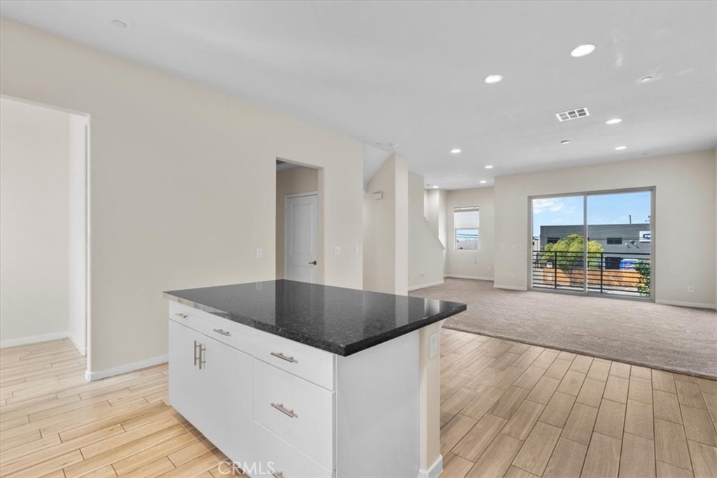 726 Central Avenue Upland, CA 91786 - Photo 12 of 42 a kitchen with stainless steel appliances granite countertop a sink and a oven