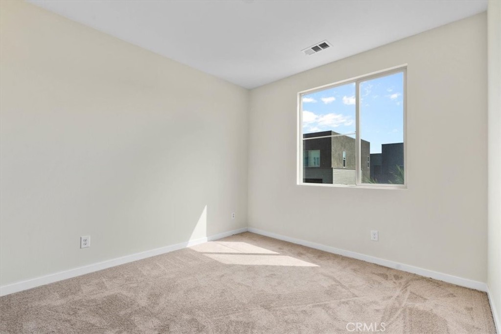 726 Central Avenue Upland, CA 91786 - Photo 17 of 42 a view of an empty room with a window