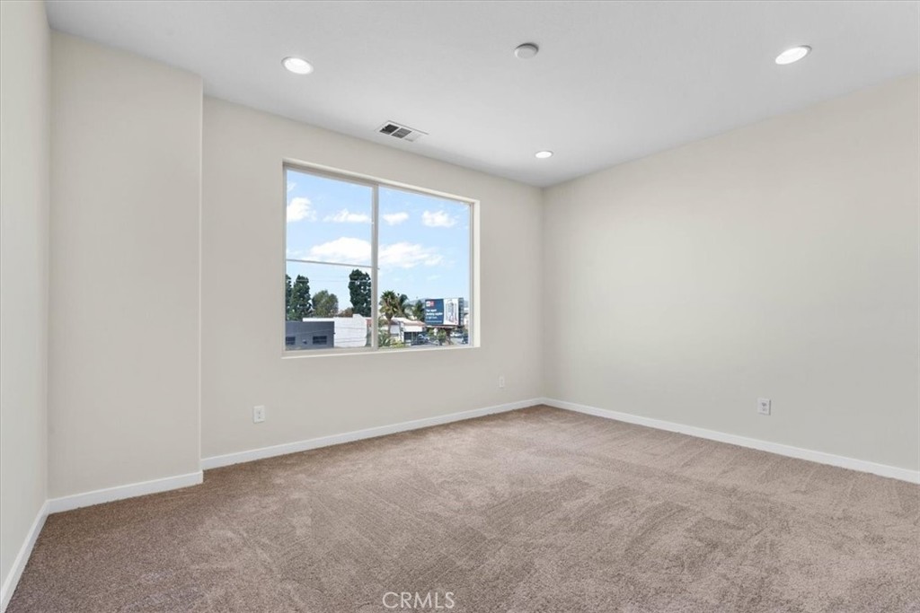 726 Central Avenue Upland, CA 91786 - Photo 20 of 42 an empty room with windows