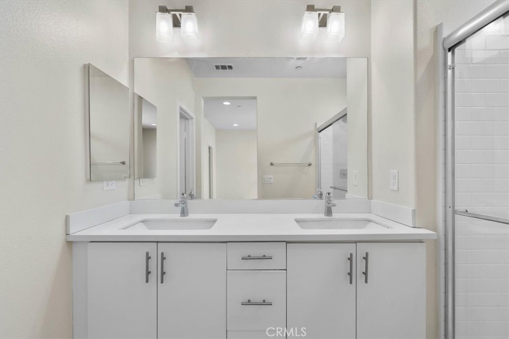 726 Central Avenue Upland, CA 91786 - Photo 24 of 42 a bathroom with a sink and a mirror