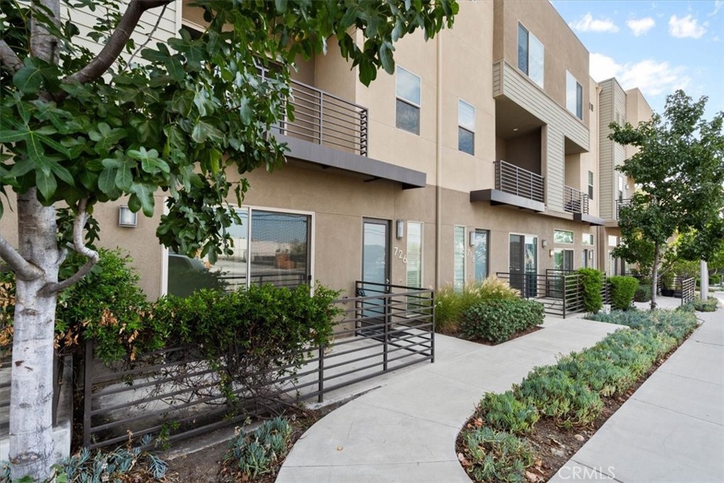 726 Central Avenue Upland, CA 91786 - Photo 3 of 42 a front view of a house with a yard