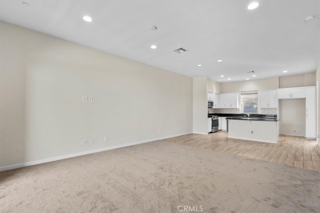 726 Central Avenue Upland, CA 91786 - Photo 7 of 42 a view of kitchen with stainless steel appliances refrigerator sink and cabinets