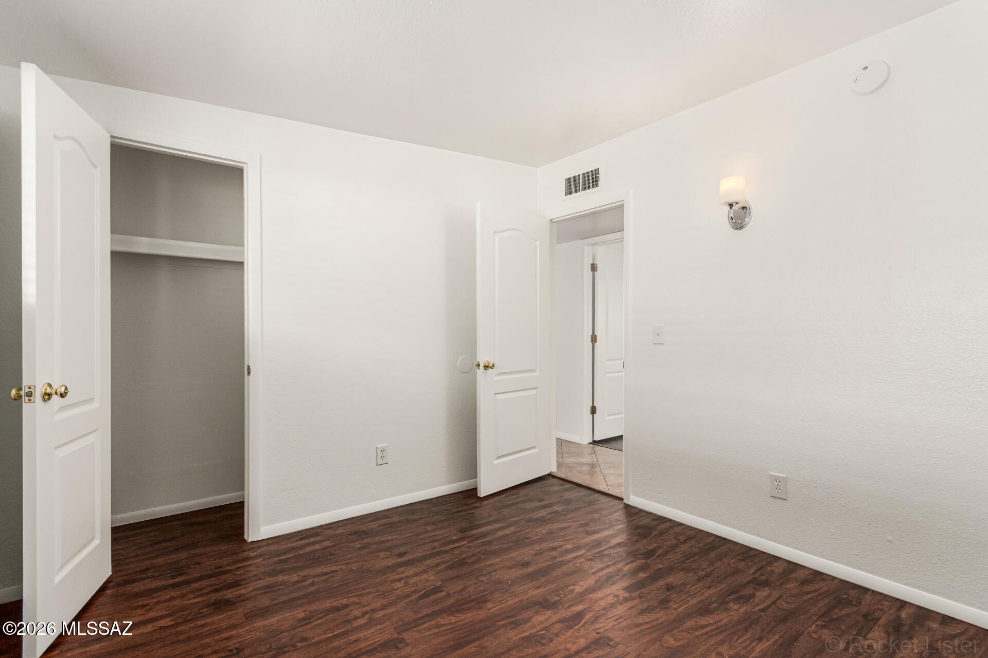 17 East Los Reales Road Tucson, AZ 85756 - Photo 19 of 27 a view of an empty room with wooden floor