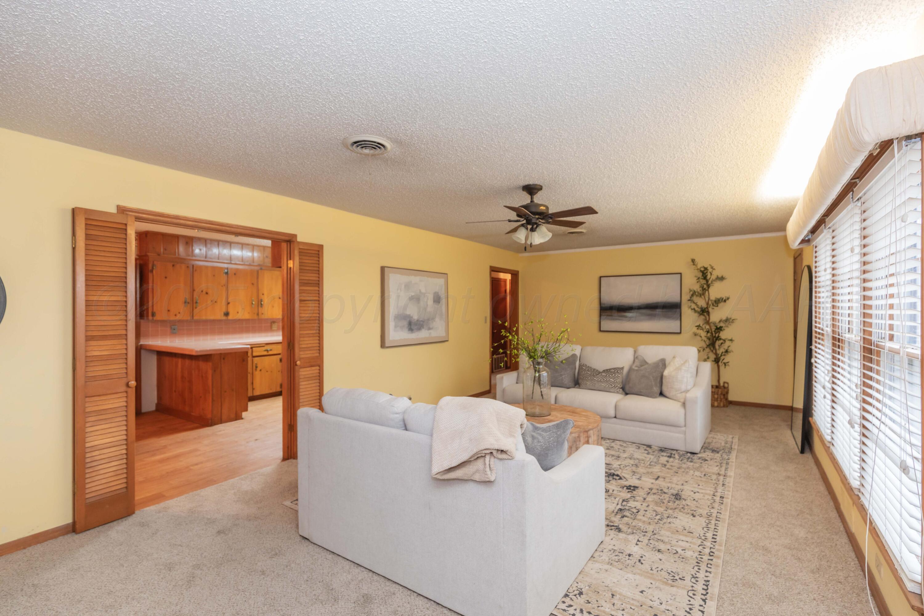 4221 Arden Road Amarillo, TX 79110 - Photo 11 of 50 a living room with furniture and a window