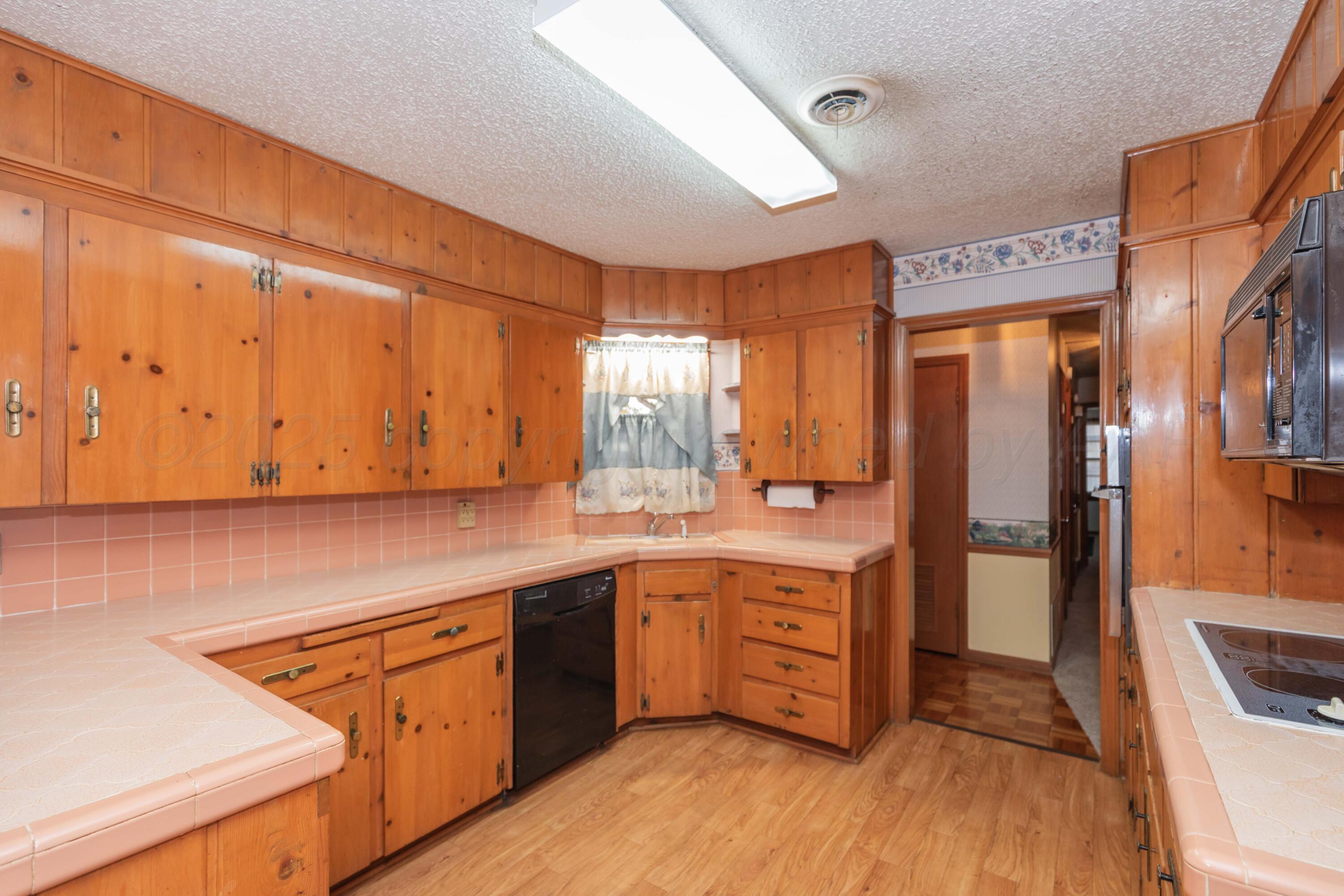 4221 Arden Road Amarillo, TX 79110 - Photo 13 of 50 a kitchen with stainless steel appliances granite countertop a stove a sink and a refrigerator