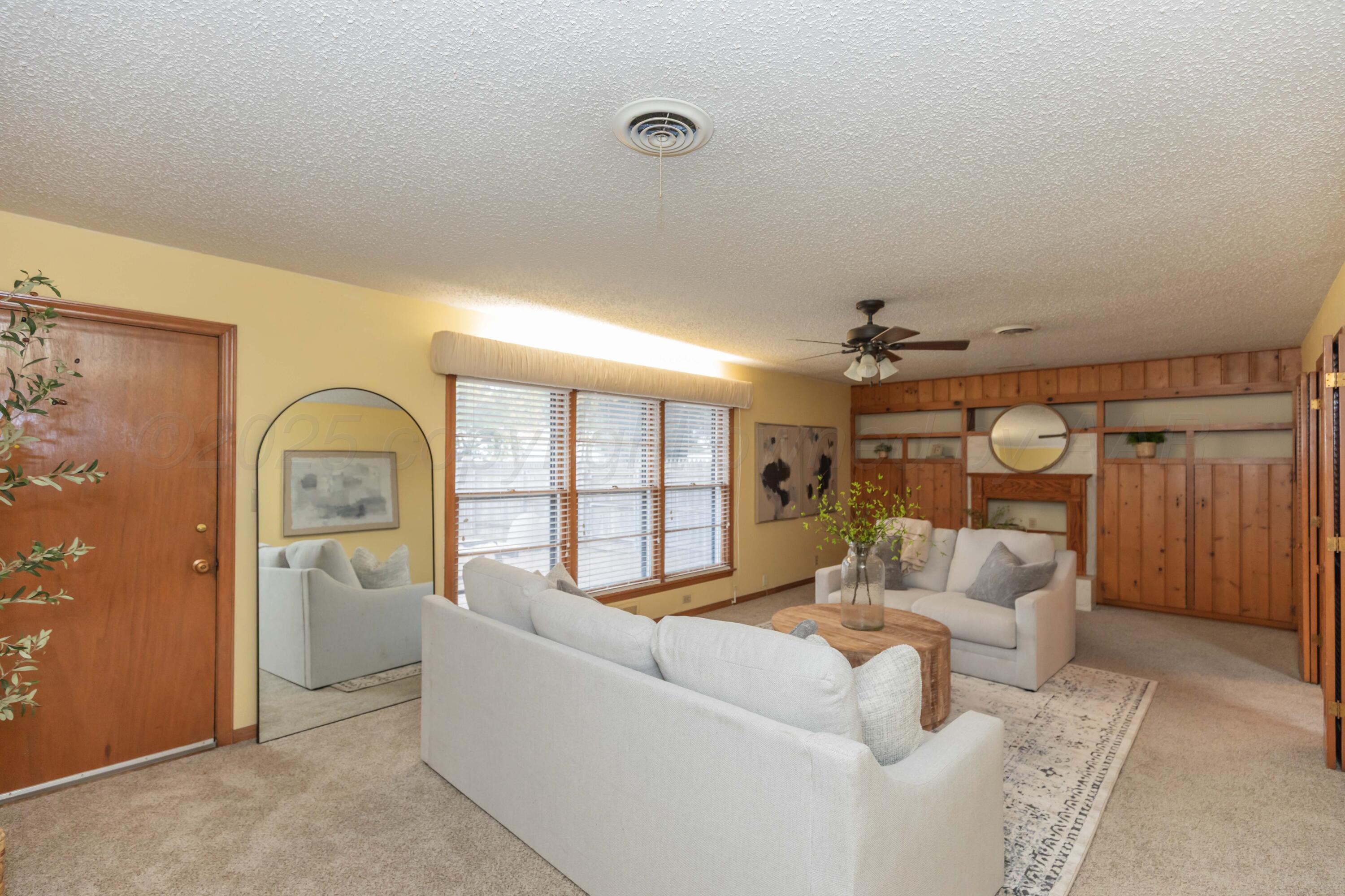 4221 Arden Road Amarillo, TX 79110 - Photo 3 of 50 a living room with furniture and a large window