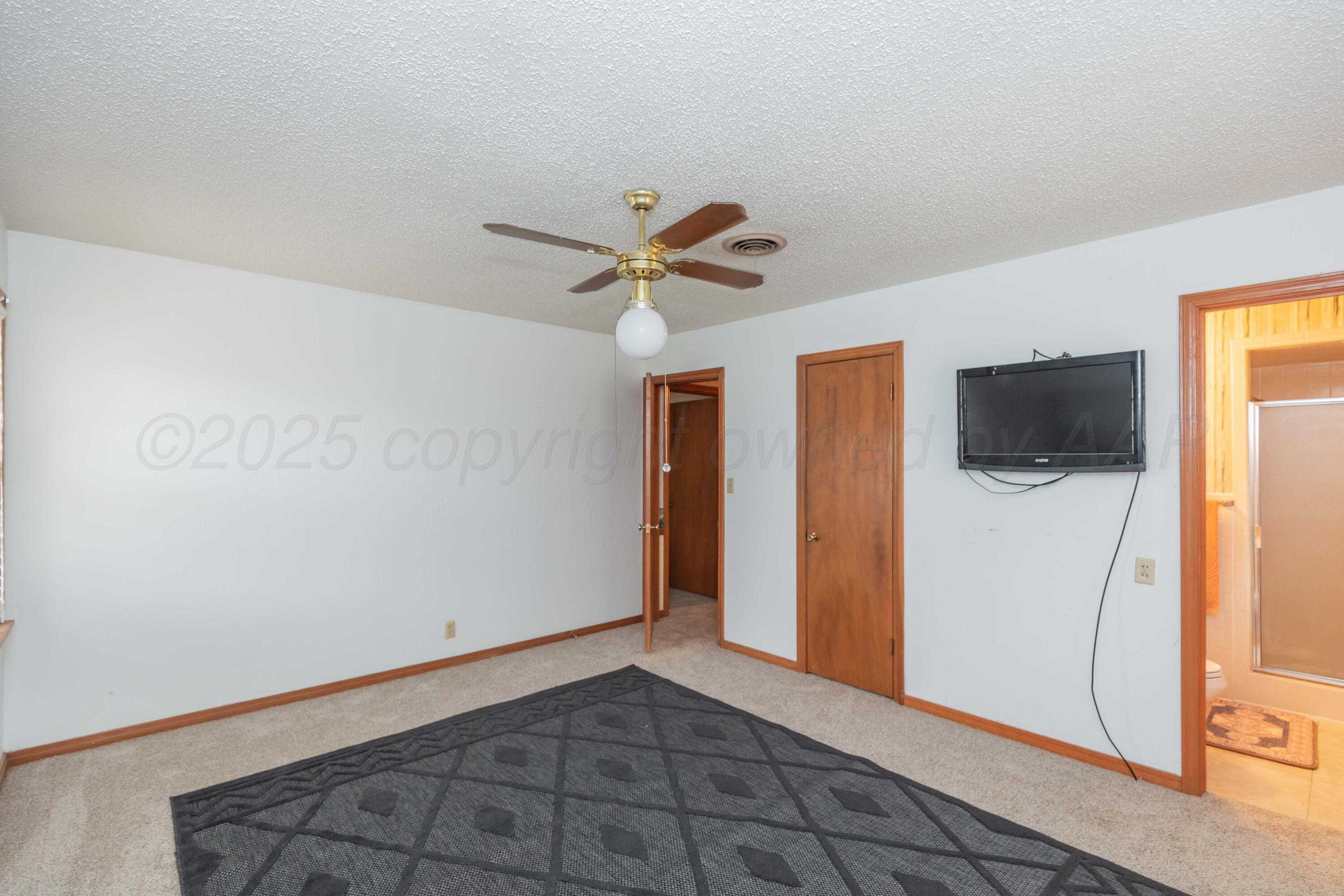 4221 Arden Road Amarillo, TX 79110 - Photo 31 of 50 a view of a livingroom with a flat screen tv