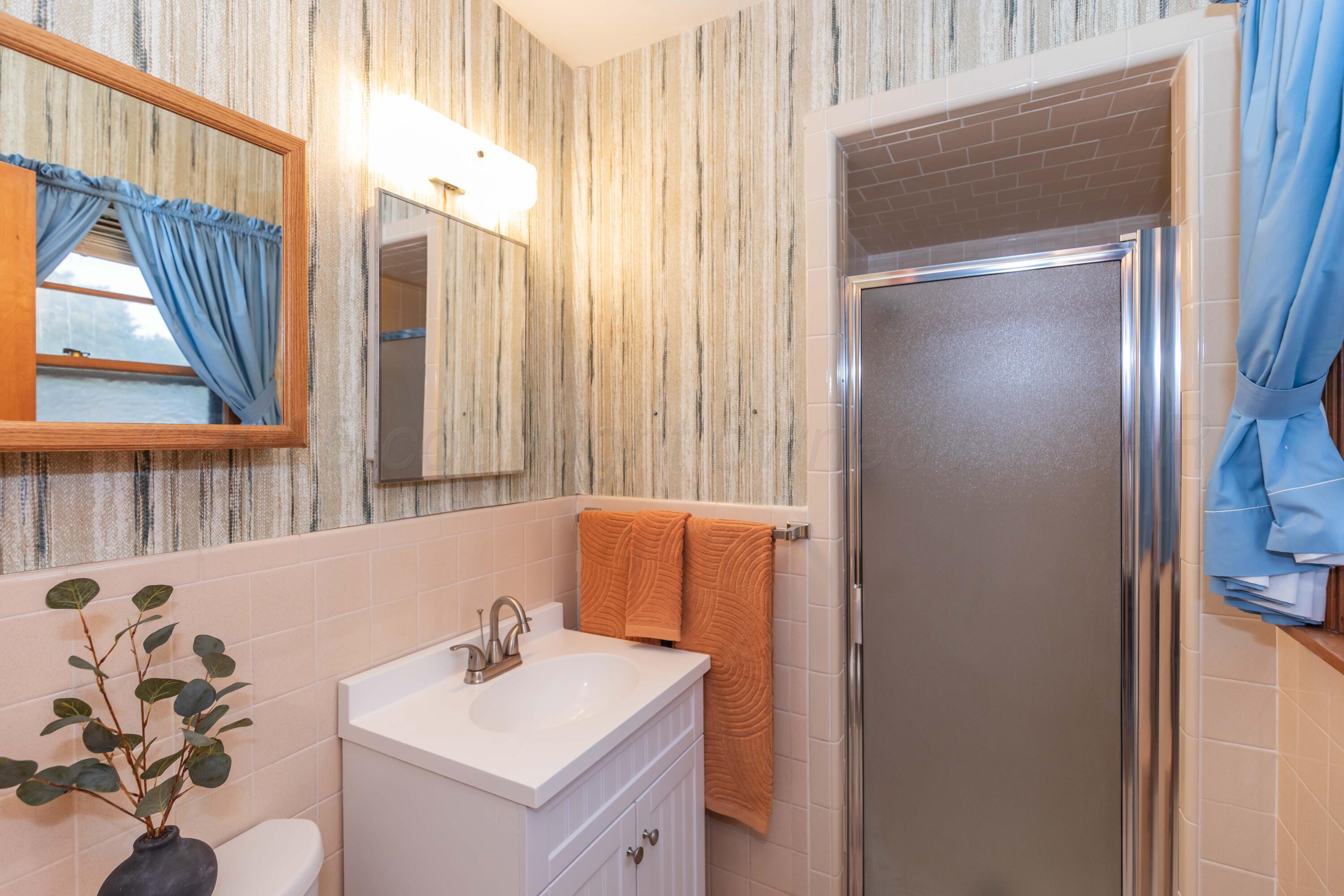 4221 Arden Road Amarillo, TX 79110 - Photo 33 of 50 a bathroom with a sink and a mirror