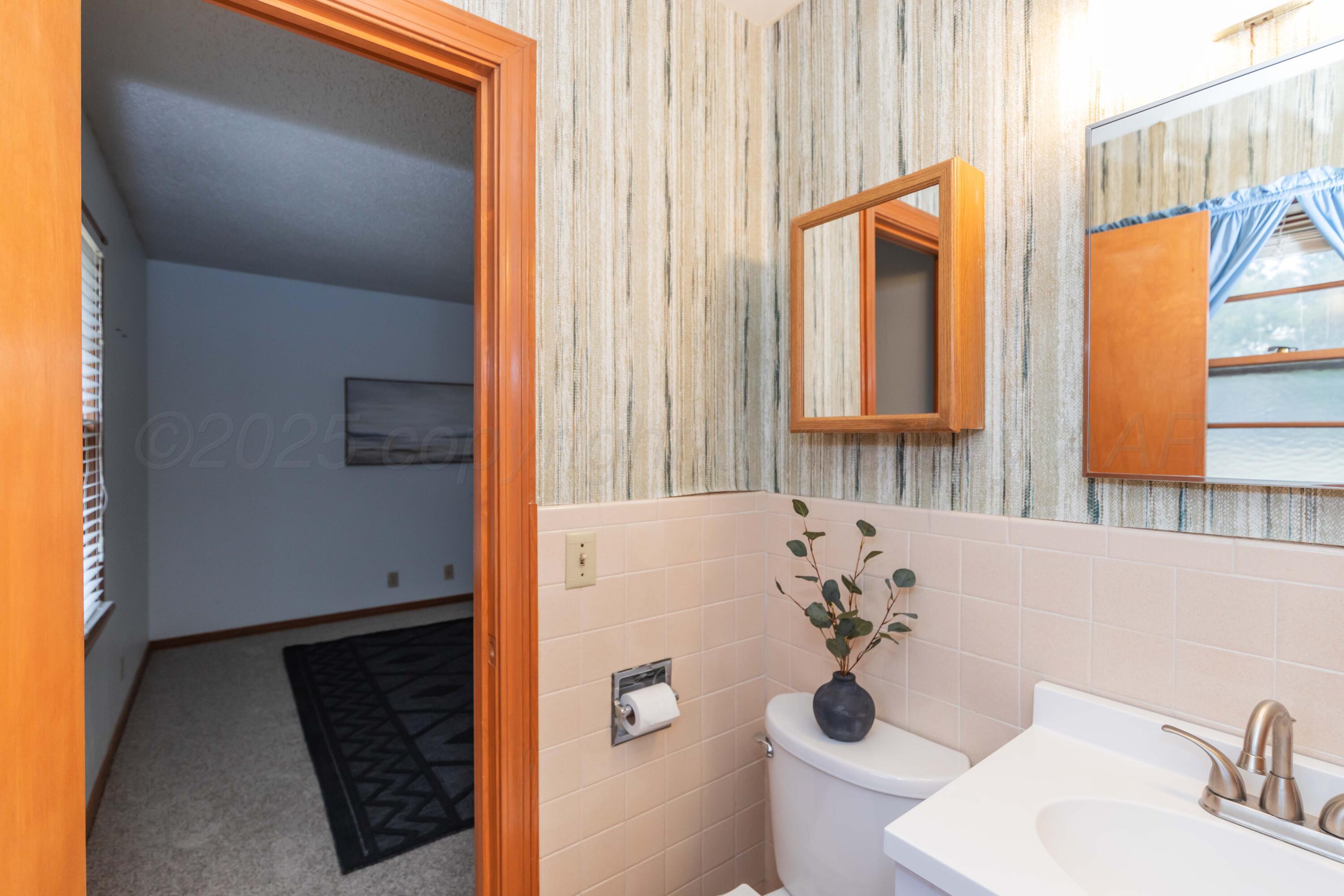 4221 Arden Road Amarillo, TX 79110 - Photo 35 of 50 a bathroom with a bathtub and a sink