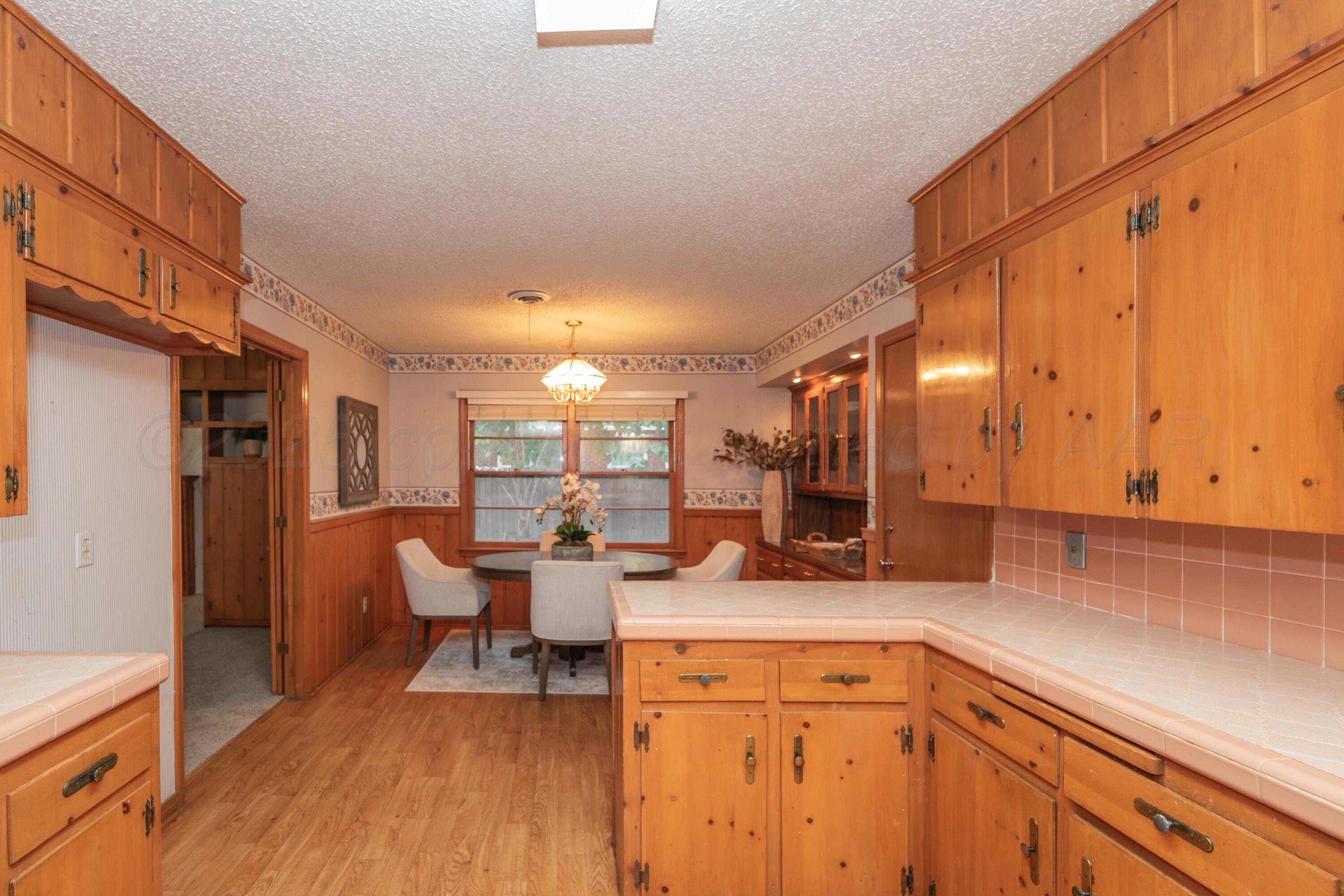 4221 Arden Road Amarillo, TX 79110 - Photo 4 of 50 a view of a kitchen with a sink and cabinets