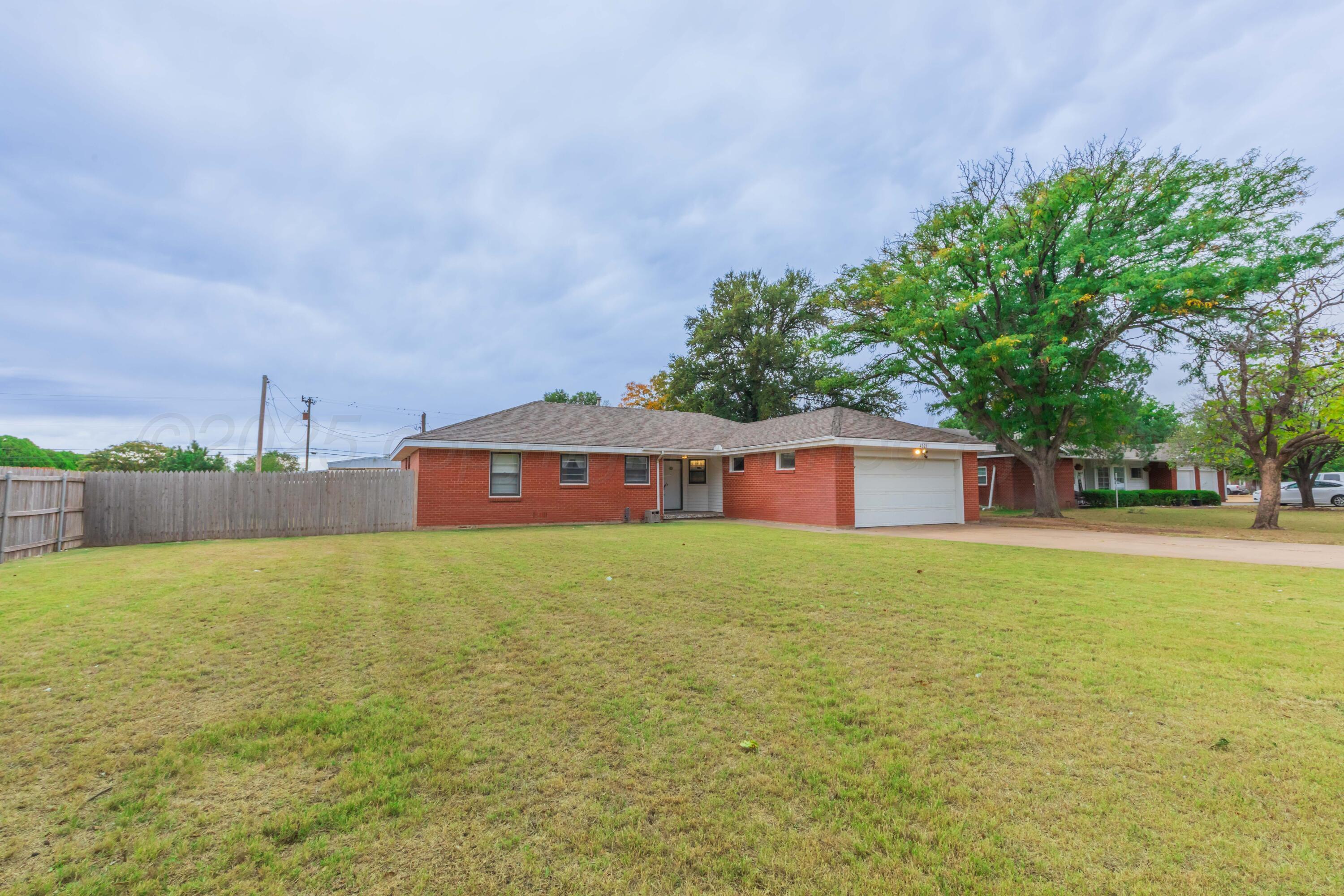 4221 Arden Road Amarillo, TX 79110 - Photo 50 of 50 a front view of a house with a yard