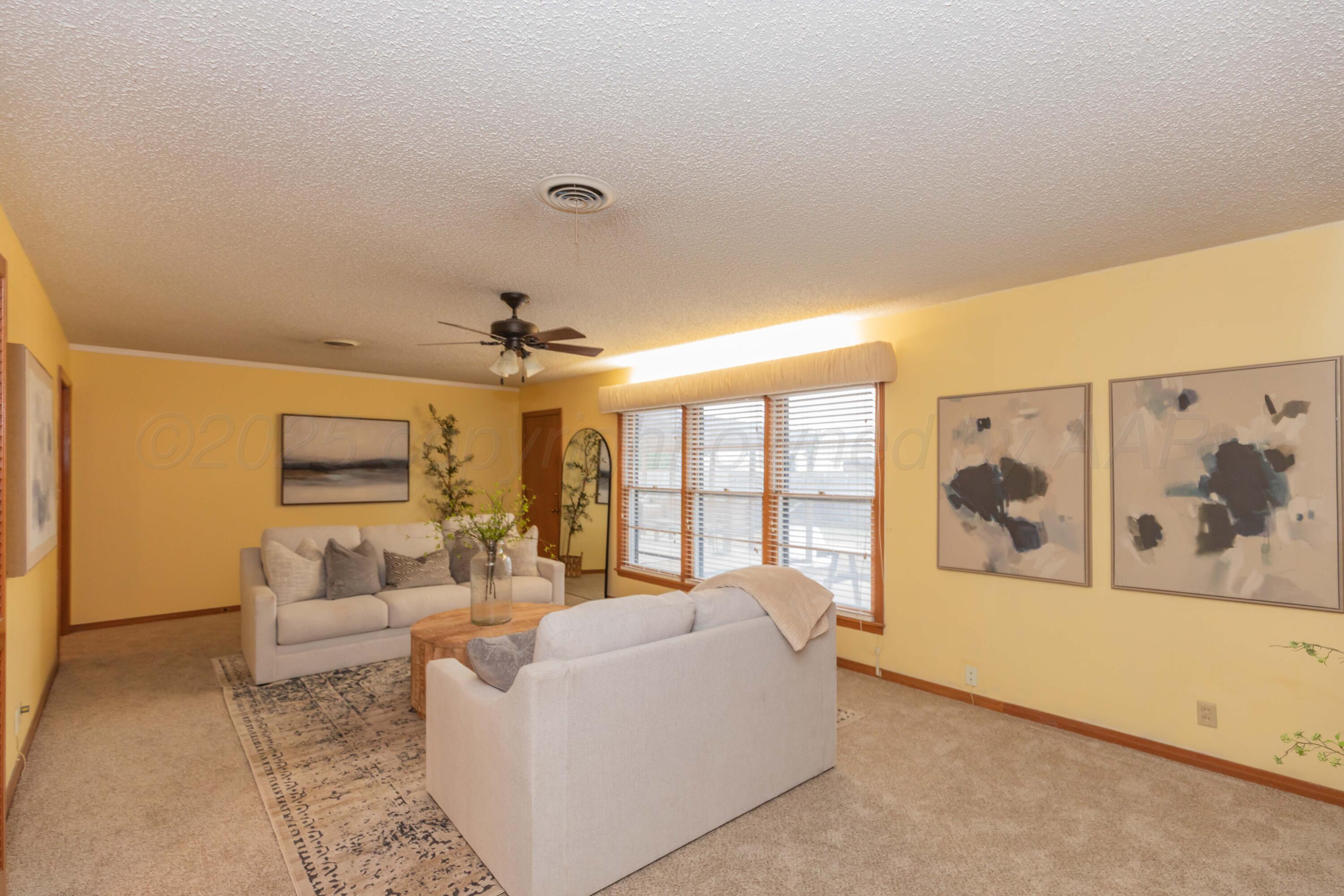 4221 Arden Road Amarillo, TX 79110 - Photo 10 of 50 a living room with furniture and large windows