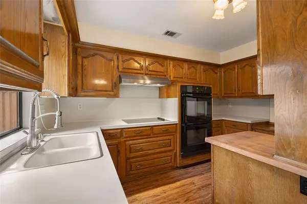 a kitchen with a stove and a refrigerator