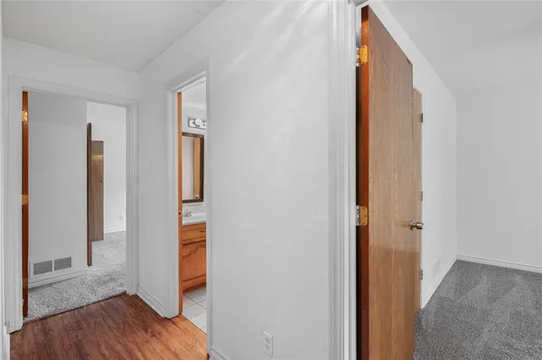 a bathroom with a granite countertop sink a mirror and a