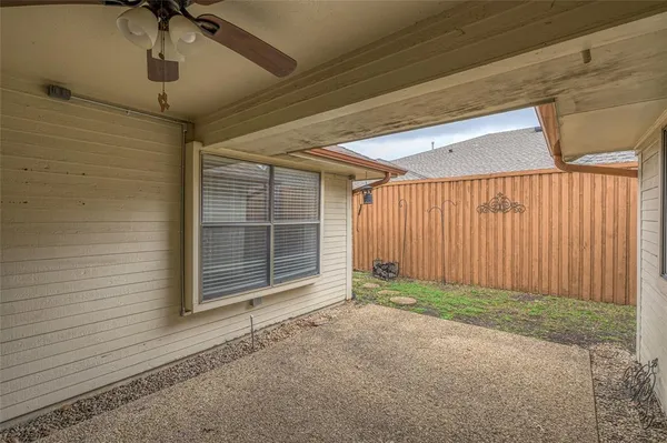 a view of a house with a door and wooden walls