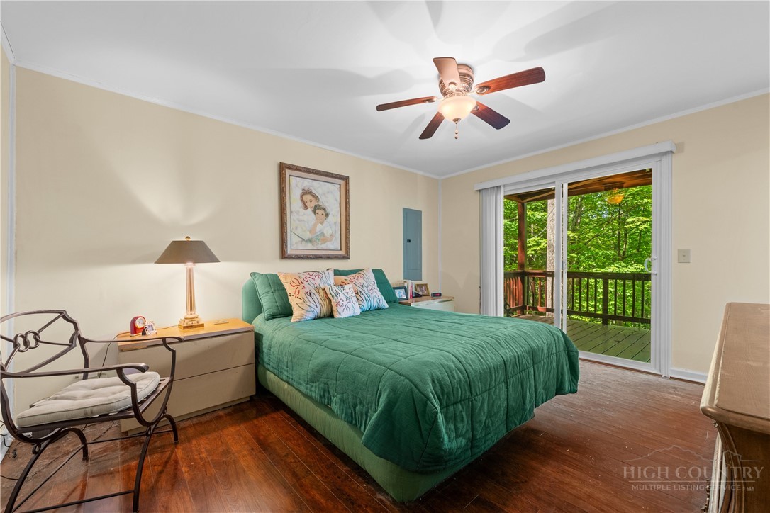 467 Horseshoe Ridge Road East Deep Gap, NC 28618 - Photo 24 of 46 a bedroom with a bed and a window
