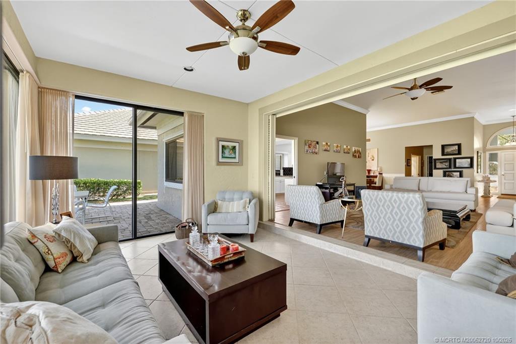 6957 Southeast Pacific Drive Stuart, FL 34997 - Photo 14 of 71 a living room with furniture and a large window