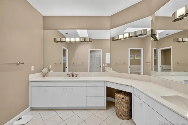 a kitchen with a refrigerator and a sink