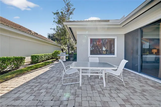 an aerial view of a residential houses with outdoor space and street view