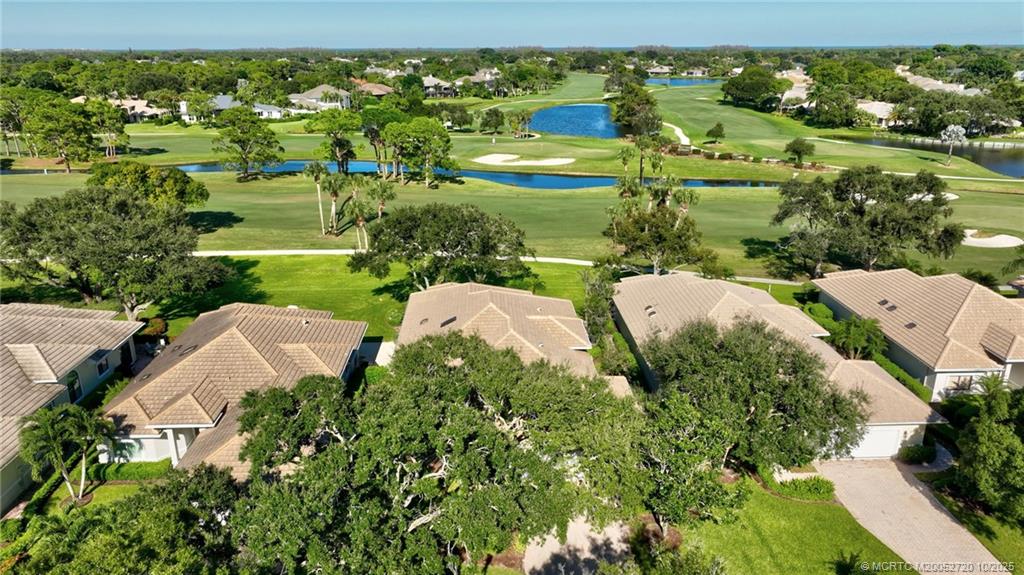 6957 Southeast Pacific Drive Stuart, FL 34997 - Photo 48 of 71 an aerial view of a residential houses with outdoor space and street view
