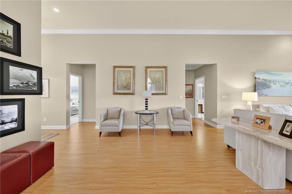 6957 Southeast Pacific Drive Stuart, FL 34997 - Photo 5 of 71 a living room with furniture and a fireplace