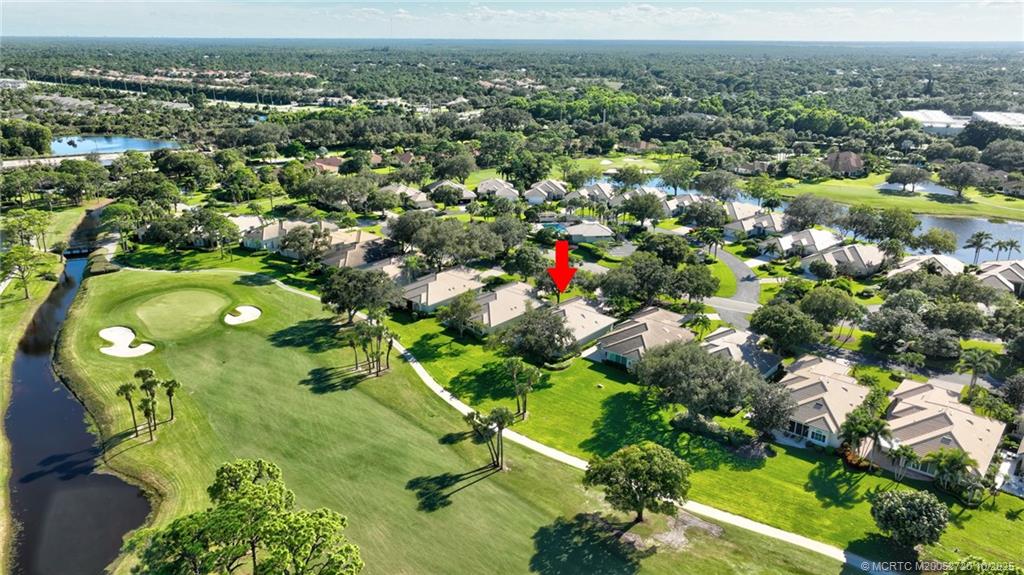 6957 Southeast Pacific Drive Stuart, FL 34997 - Photo 56 of 71 an aerial view of a residential houses with outdoor space and street view