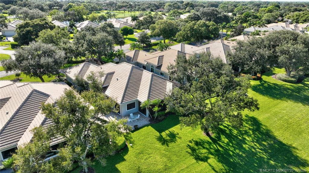6957 Southeast Pacific Drive Stuart, FL 34997 - Photo 59 of 71 an aerial view of residential house with outdoor space and trees all around