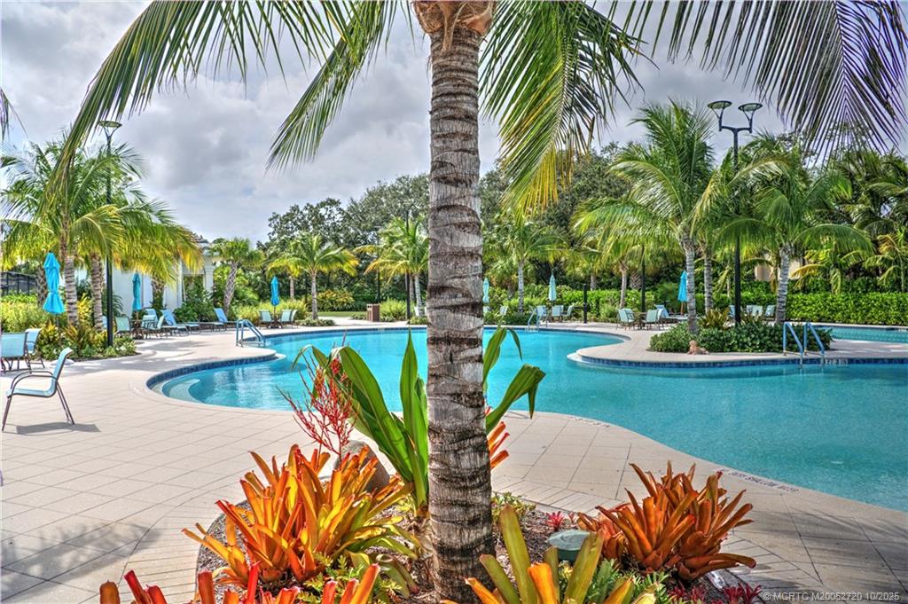 6957 Southeast Pacific Drive Stuart, FL 34997 - Photo 65 of 71 a view of outdoor space yard and swimming pool