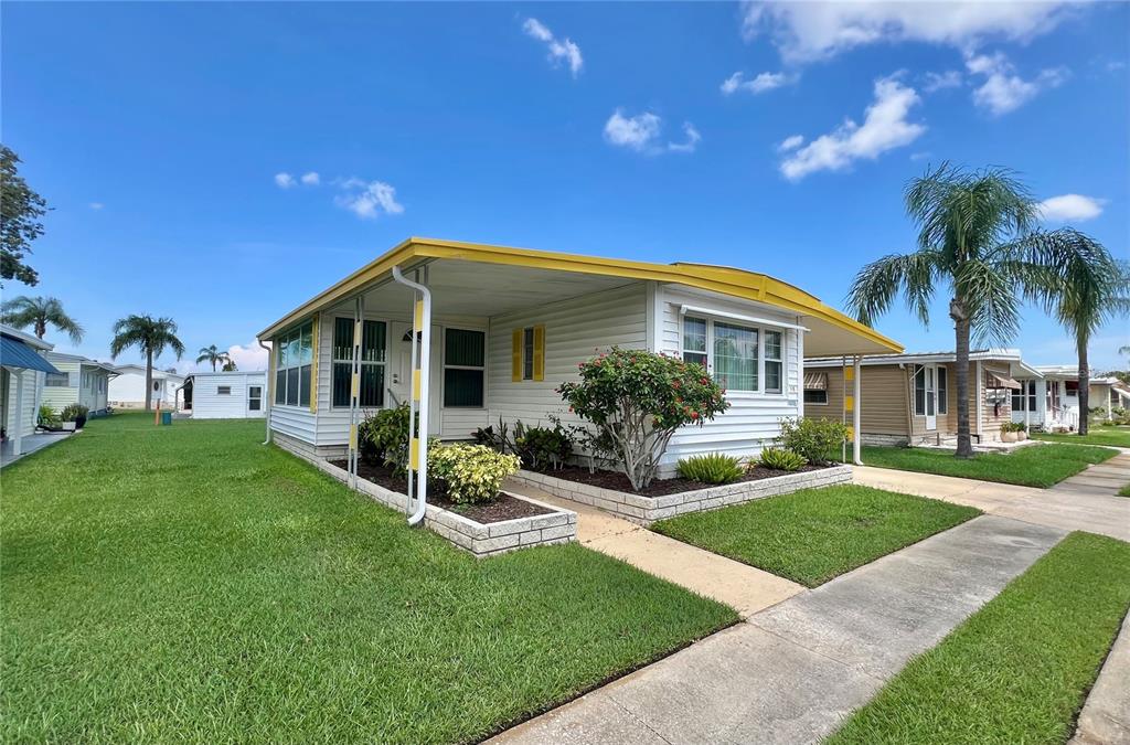 1100 South Belcher Road, Unit 115 Largo, FL 33771 - Photo 1 of 1 Front of home with great curb appeal