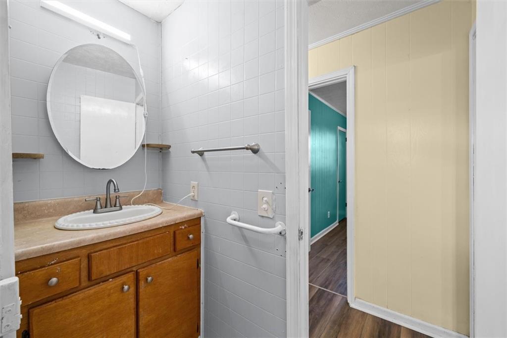 133 2nd Street Calhoun, GA 30701 - Photo 19 of 33 a bathroom with a sink and a mirror