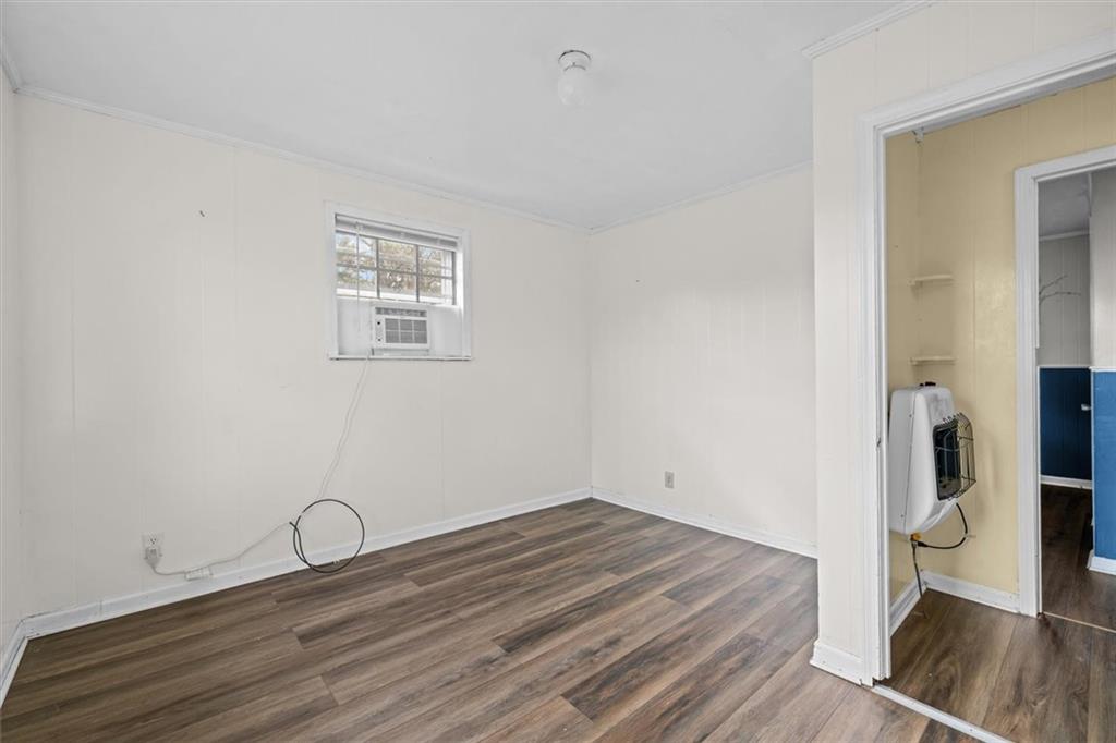 133 2nd Street Calhoun, GA 30701 - Photo 25 of 33 a room with a wooden floor and a window