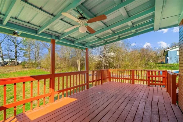 a view of porch with wooden floor
