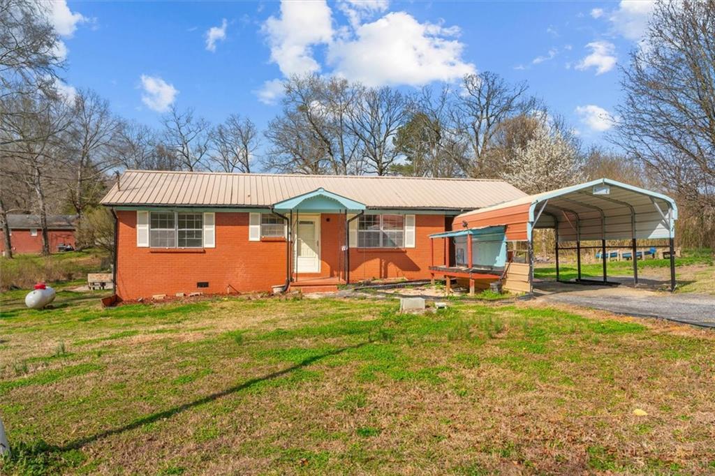 133 2nd Street Calhoun, GA 30701 - Photo 3 of 33 a view of a house with a yard