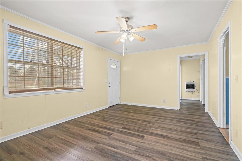 133 2nd Street Calhoun, GA 30701 - Photo 7 of 33 a view of an empty room with wooden floor and a window