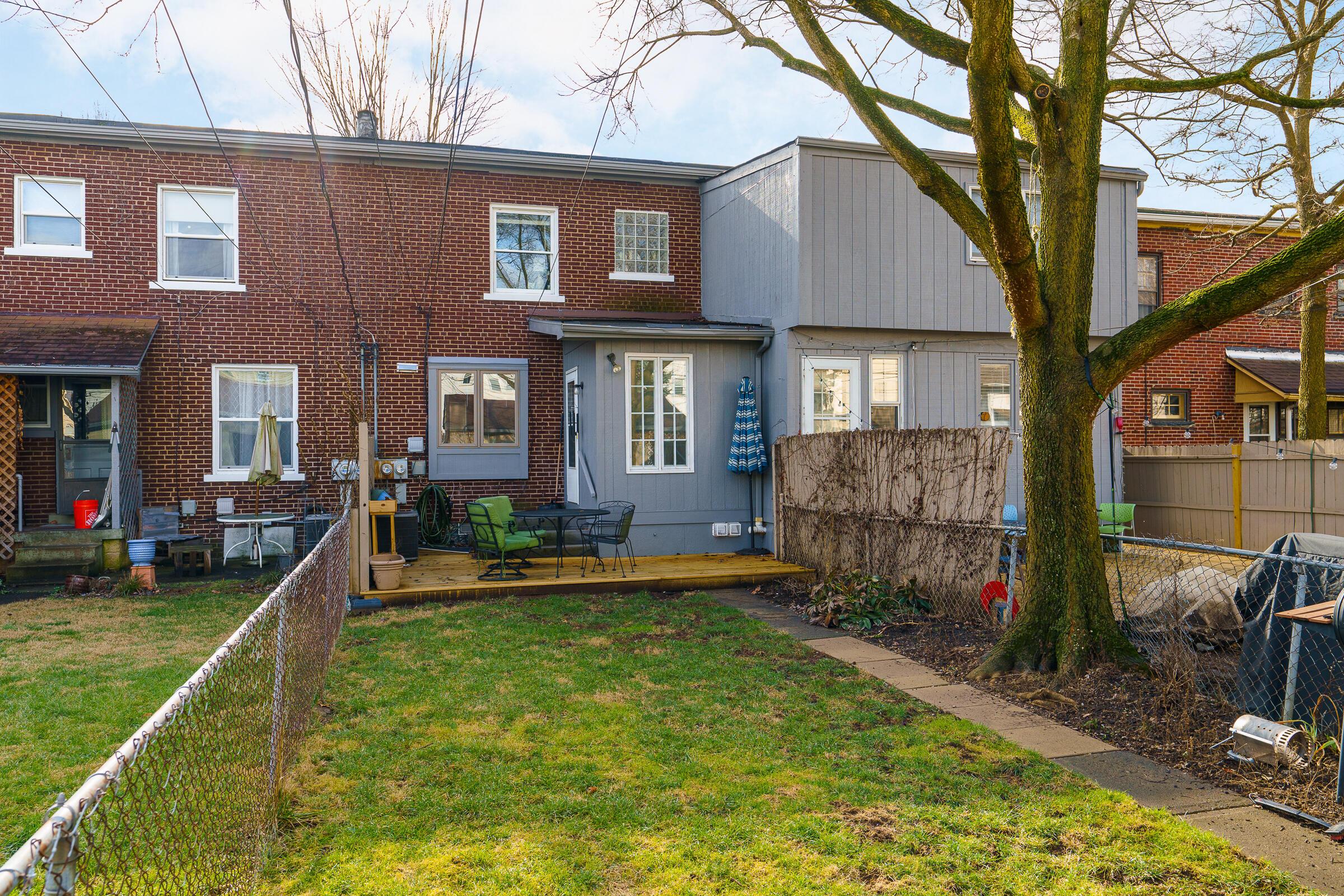 Back of Unit 90 with an updated deck & fenced yard.