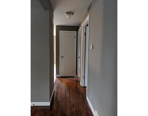 2199 Page Boulevard Springfield, MA 01151 - Photo 13 of 26 a view of a hallway with wooden floor