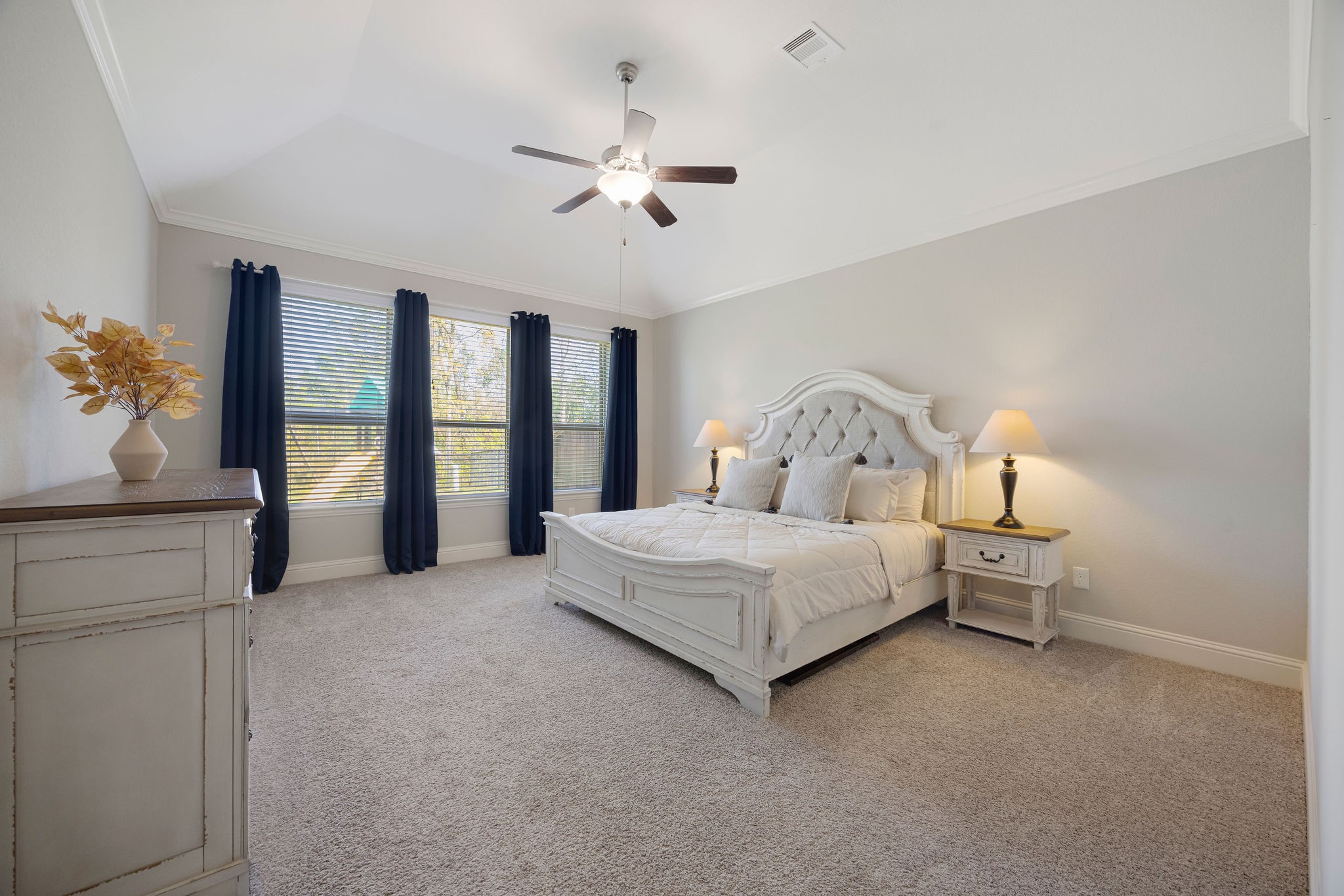 13103 Six Rivers Drive Humble, TX 77346 - Photo 11 of 44 The owner’s suite offers a spacious layout, high ceilings, abundant natural light, and overlooks the tree-lined backyard.