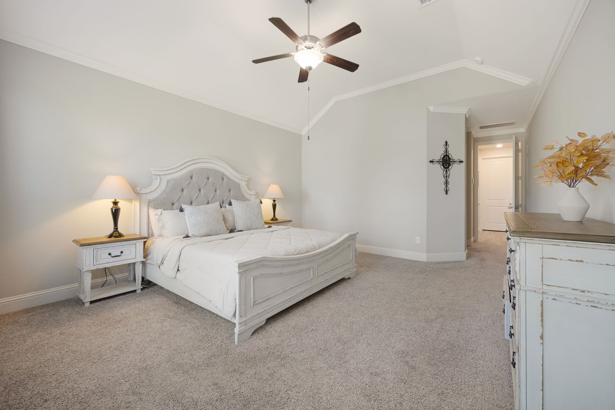 13103 Six Rivers Drive Humble, TX 77346 - Photo 12 of 44 The owner’s suite offers a spacious layout, high ceilings, abundant natural light, and overlooks the tree-lined backyard.