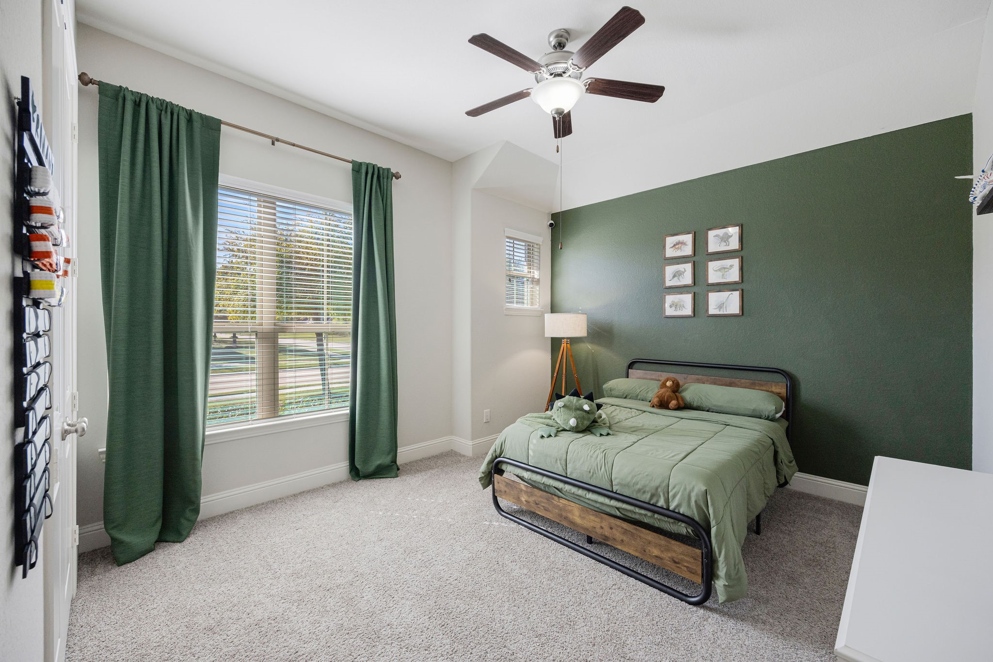 13103 Six Rivers Drive Humble, TX 77346 - Photo 16 of 44 Spacious first-floor secondary bedroom with abundant natural light and views of the front yard.