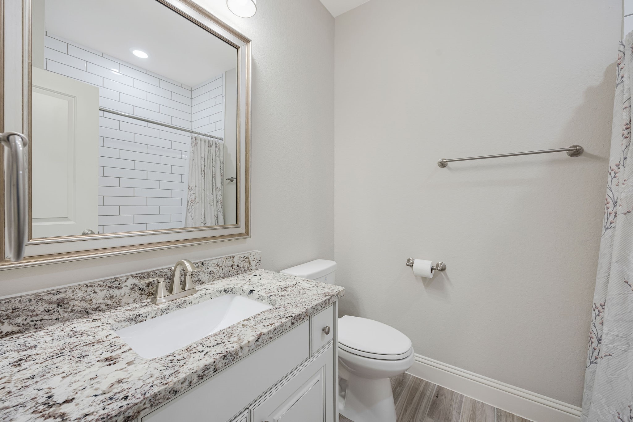 13103 Six Rivers Drive Humble, TX 77346 - Photo 25 of 44 The upstairs full bath features a tub/shower combo, granite counters, and tile extended to the ceiling.